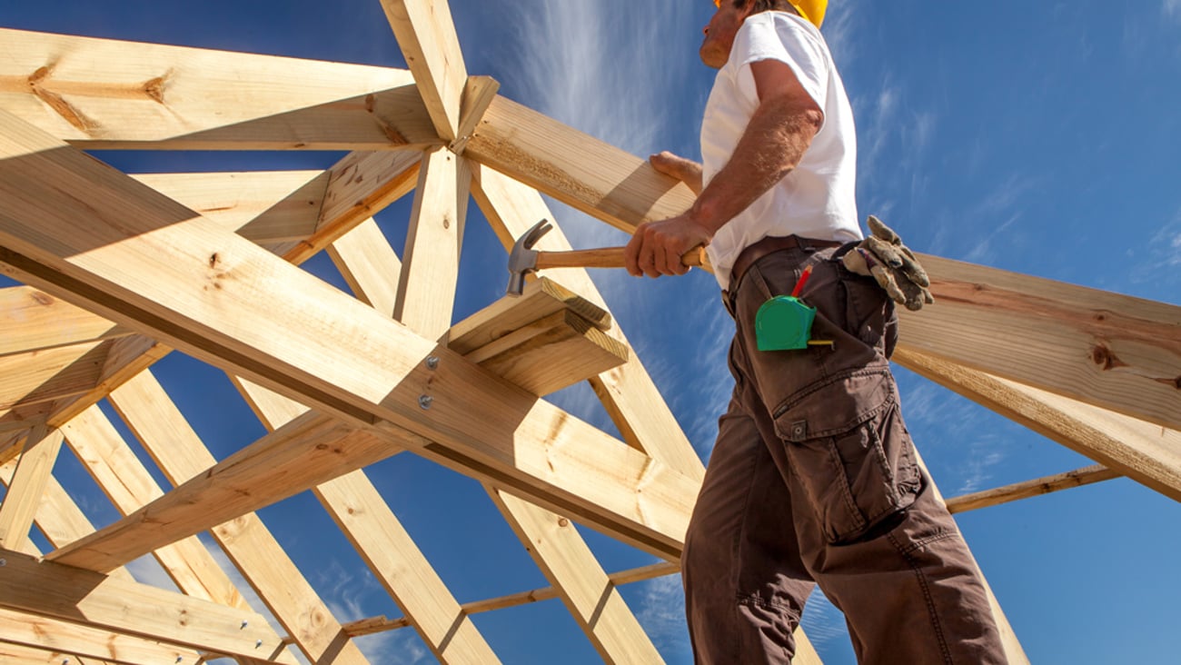 a person standing on top of a wooden ramp