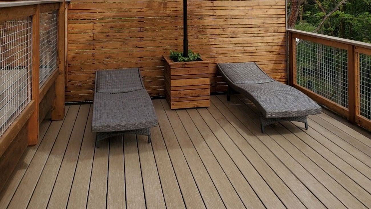 a wooden bench sitting in front of a building