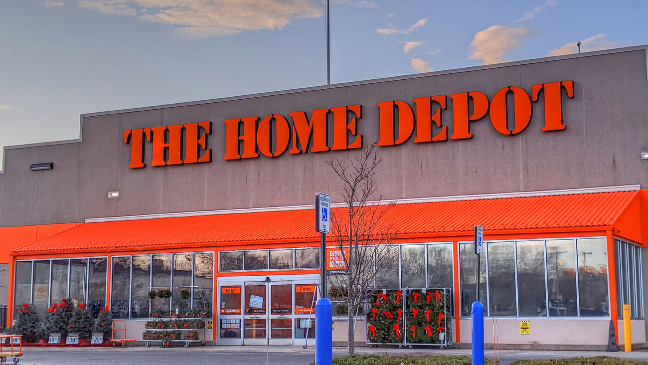 The Home Depot building supplier retailer, American flag waving above store sign, Chelsea Massachusetts USA, November 28, 2019; Shutterstock ID 1575365968