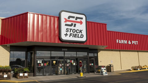 a building with a store on the side of a road