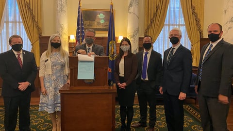 a group of people standing in a room