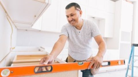 a man standing in a kitchen