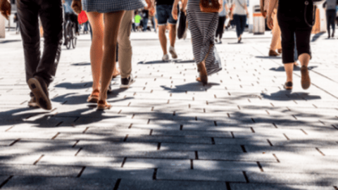 a group of people walking down the street