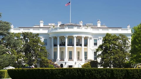 a large building in the background with White House in the background