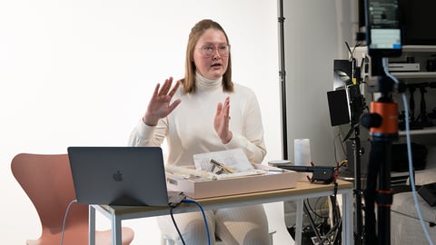 a person standing in front of a computer