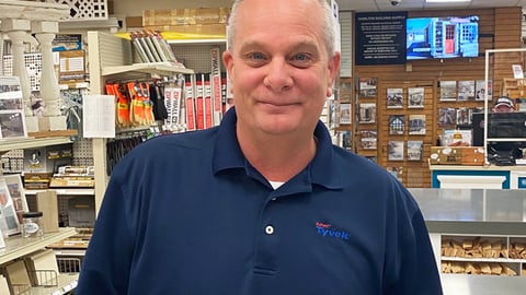 a man standing in front of a store