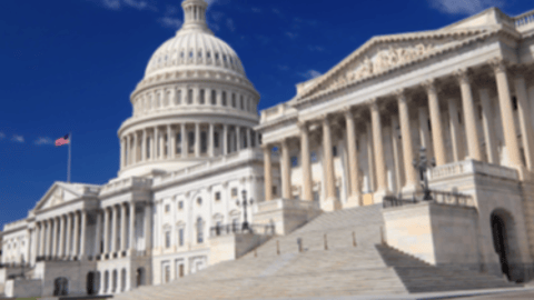 a large building with United States Capitol in the background