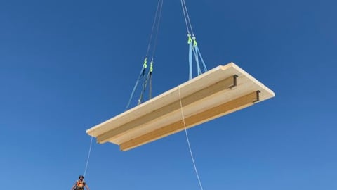 a person flying through the air on a clear blue sky