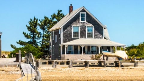 a bus parked in front of a house