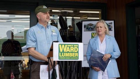 Kirsten Gillibrand standing in front of a store