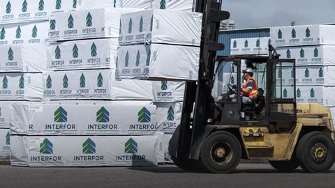 a truck is parked in front of a building