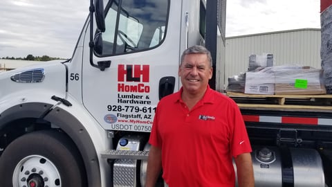 a man standing in front of a truck