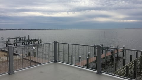 a close up of a pier next to a body of water