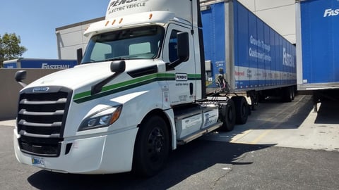 a truck parked on the side of a road