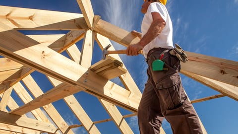 a person standing on top of a wooden ramp