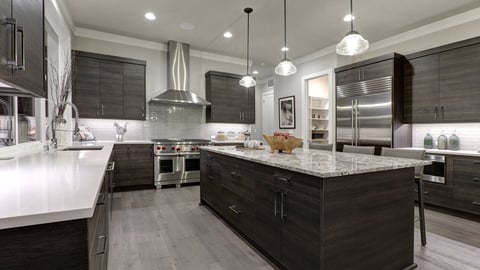 a modern kitchen with an island in the middle of a room