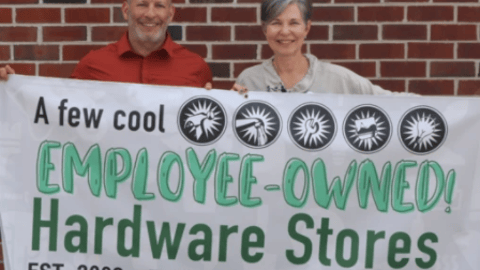 a group of people holding a sign