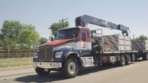 a truck that is driving down the road