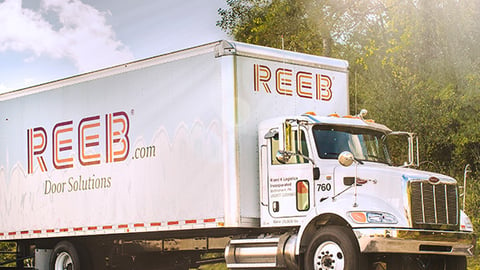 a box truck parked on the side of a road