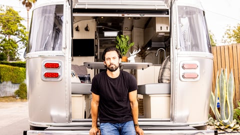 Milo Ventimiglia standing in front of a truck