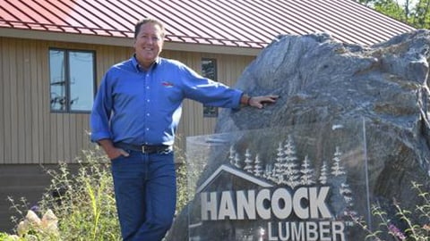 a man standing in front of a building