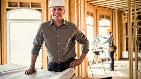 a man standing in front of a building