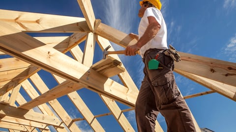 a man standing on top of a wooden ramp