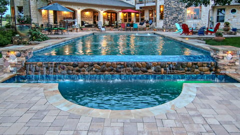 a pool next to a brick building