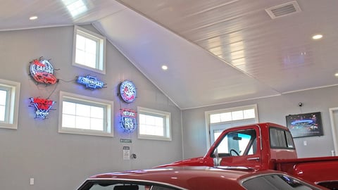 A garage featuring prefinished wall and ceiling panels from Trusscore.