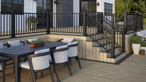 A patio setting featuring decking, railing and accessories from Deckorators.