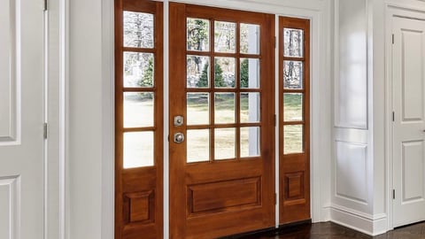 A home entrance featuring millwork from Metrie.