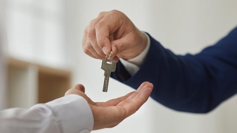 Key exchange. Close up unrecognizable male real estate agent handing key to new owner of apartment. Concept of signing contract for renting house or buying and selling it.; Shutterstock ID 2234911315