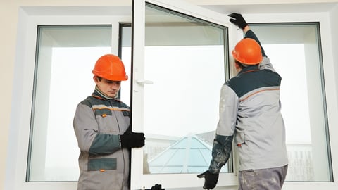 Two male industrial builders workers at window installation; Shutterstock ID 254497834