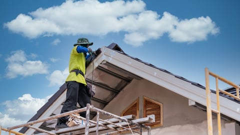 Construction worker install new ceramic tile roof, Roofing tools, Electric drill used on new roofs on construction site.; Shutterstock ID 1892112883