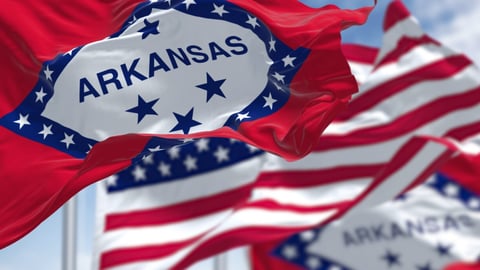 The flags of the Arkansas state and United States waving in the wind. Democracy and independence. US state flag; Shutterstock ID 2162160889