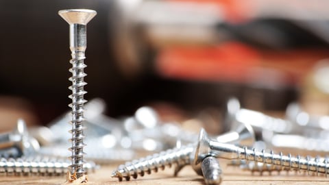 metal screw, driven into wood base, macro shot; Shutterstock ID 66857290