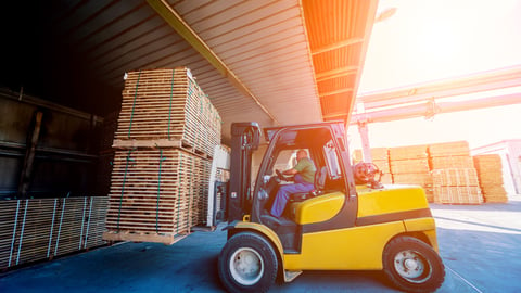 Forklift loader load lumber into a dry kiln. Wood drying in containers. Industrial concept; Shutterstock ID 1452287834