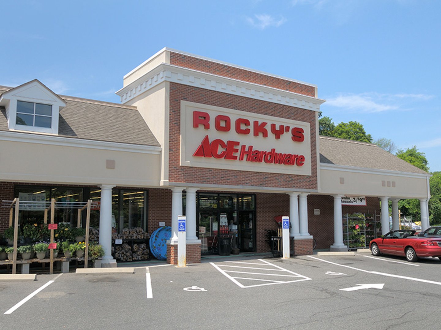 a building with a store on the corner of a street