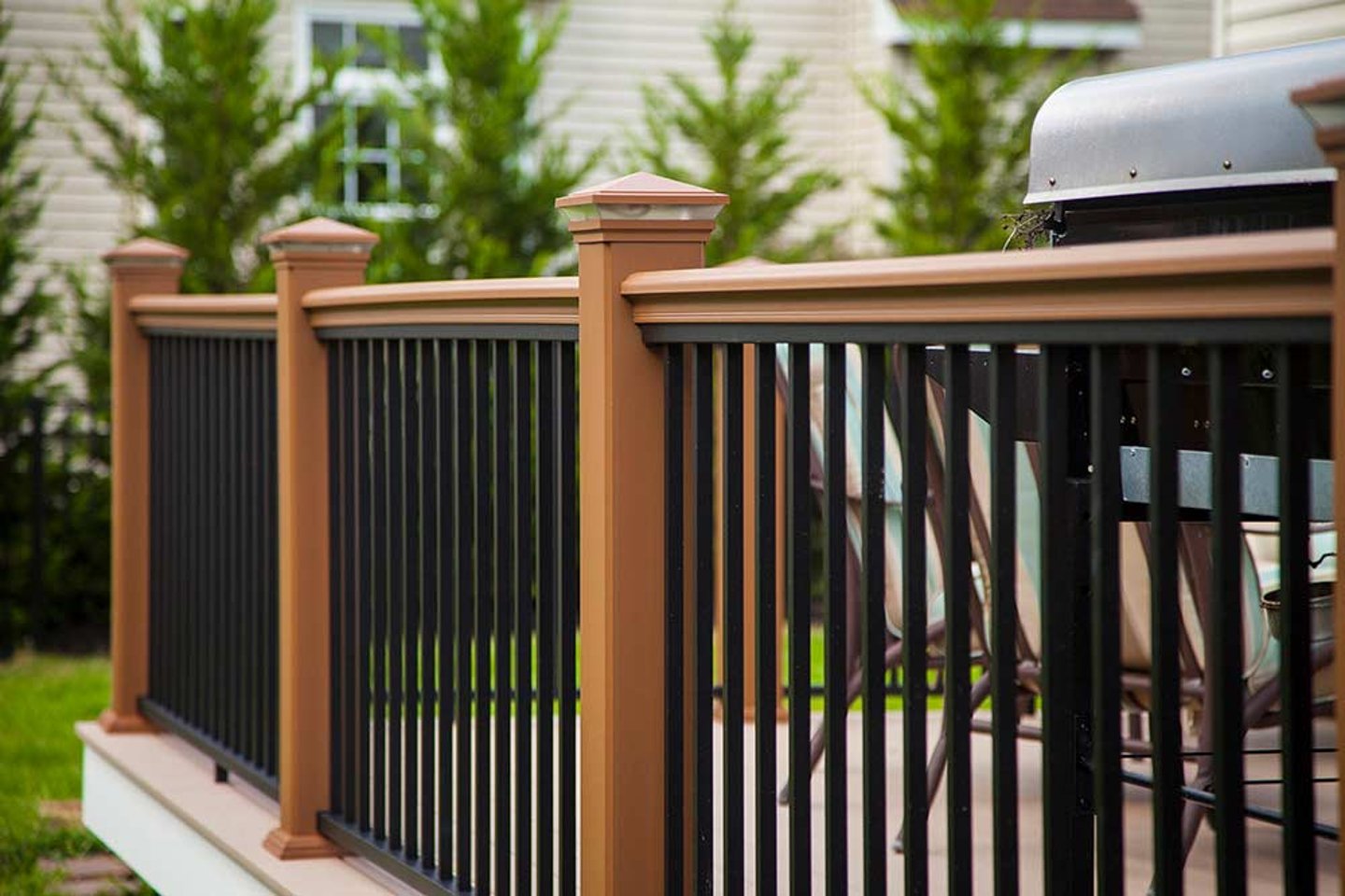 a chair sitting in front of a fence