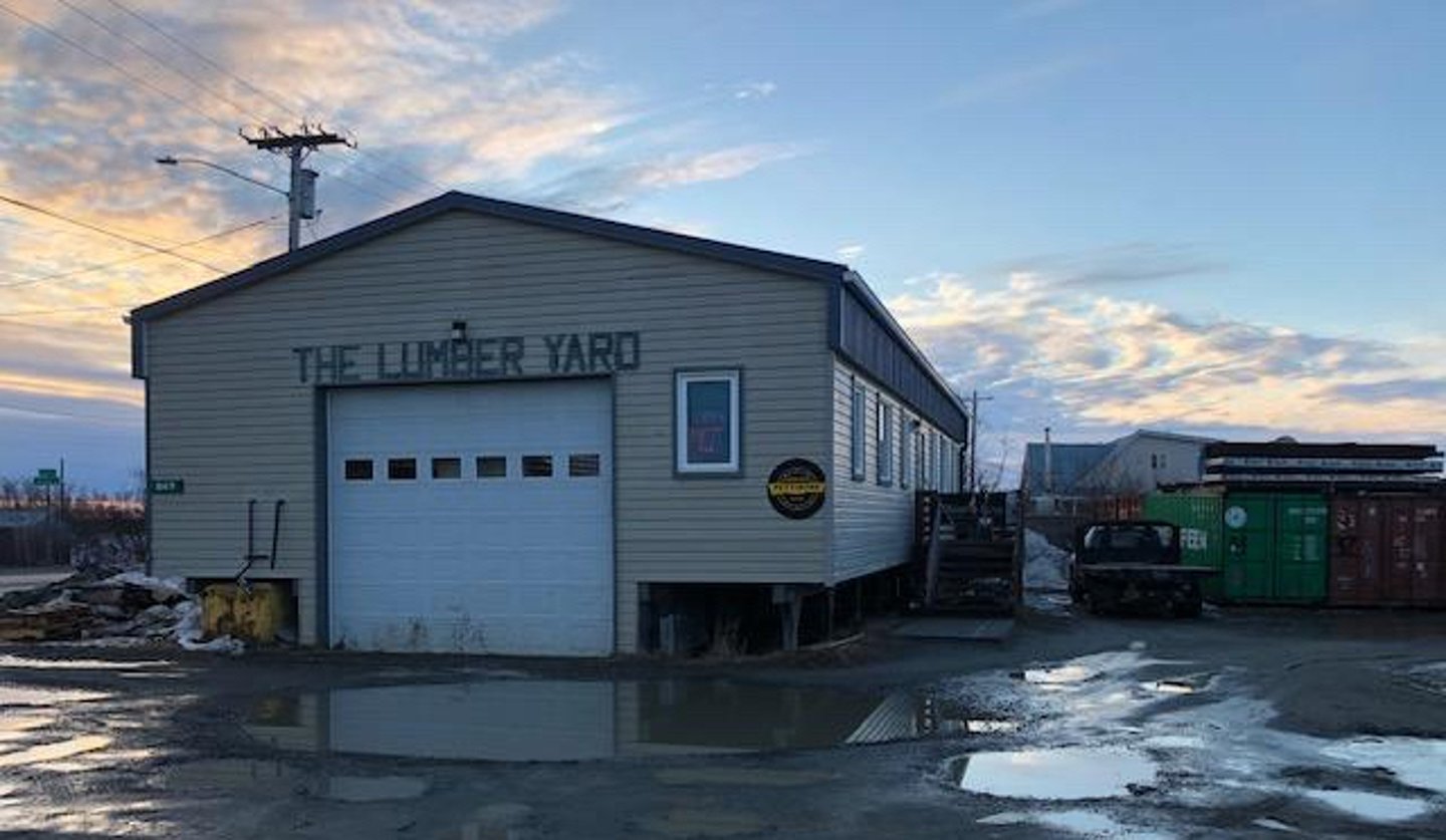 a train is parked on the side of a building