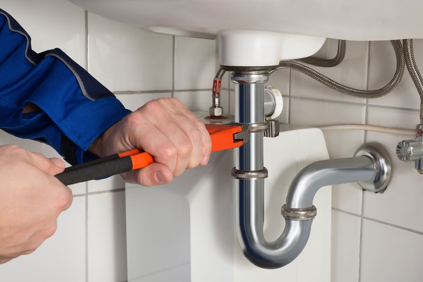 a person cutting into a sink