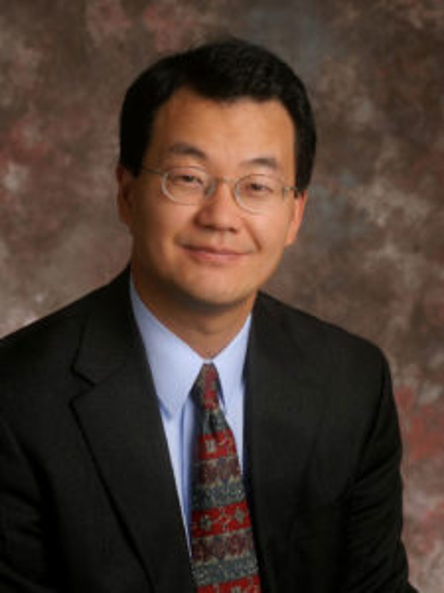 Lawrence Yun wearing a suit and tie