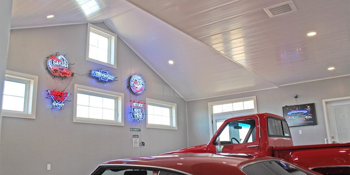 A garage featuring prefinished wall and ceiling panels from Trusscore.