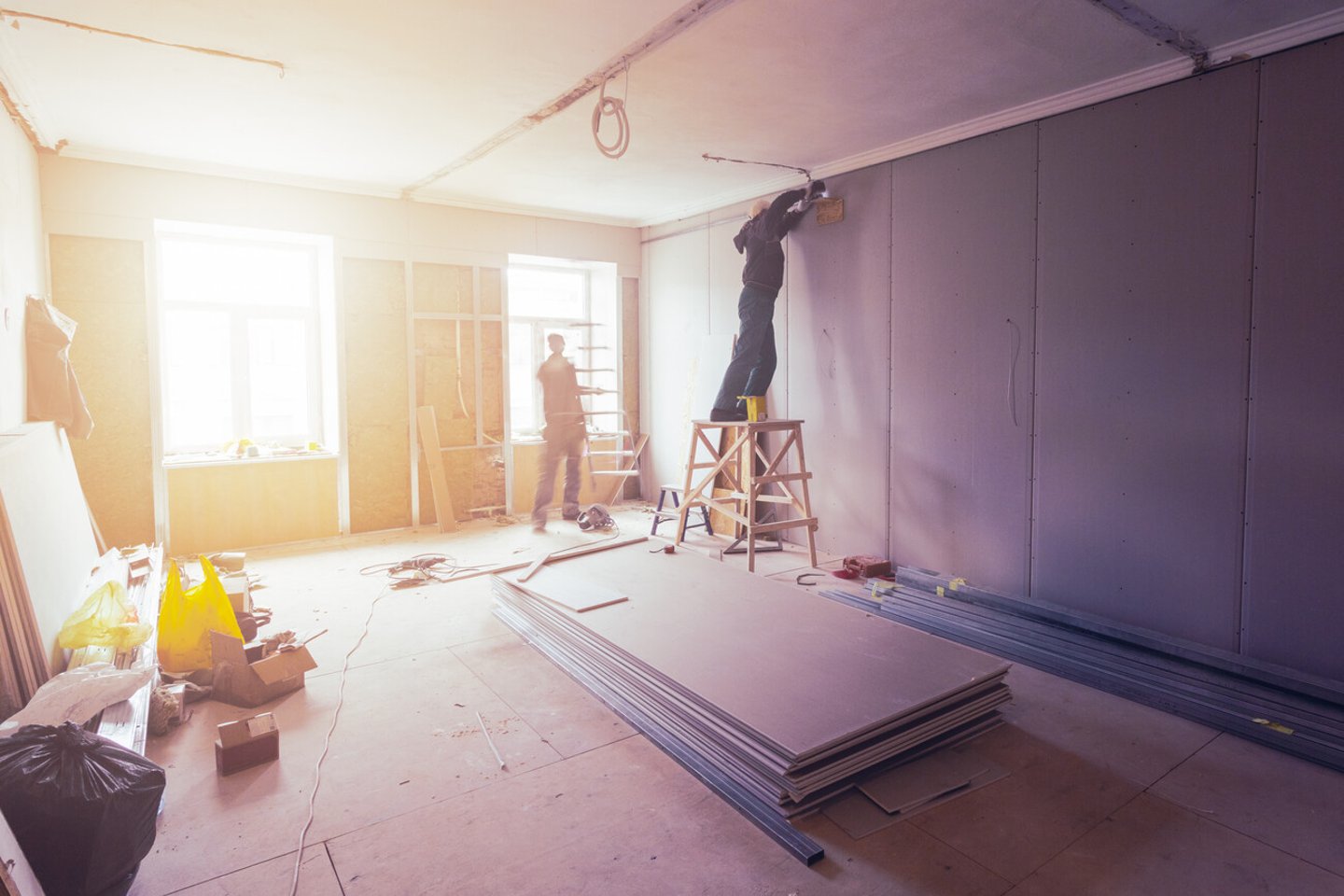 Workers are installing plasterboard (drywall) for gypsum walls in apartment is under construction, remodeling, renovation, extension, restoration and reconstruction.; Shutterstock ID 1091388662