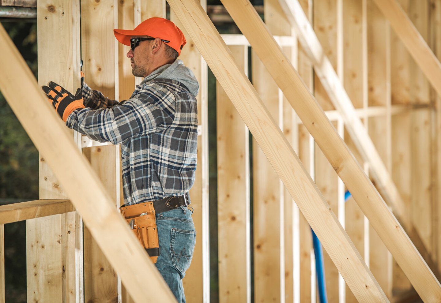 Caucasian Contractor Worker in His 30s with Drill Driver Attaching Wooden Frame Elements. Industrial Theme. Wood House Frame Construction; Shutterstock ID 1606599943