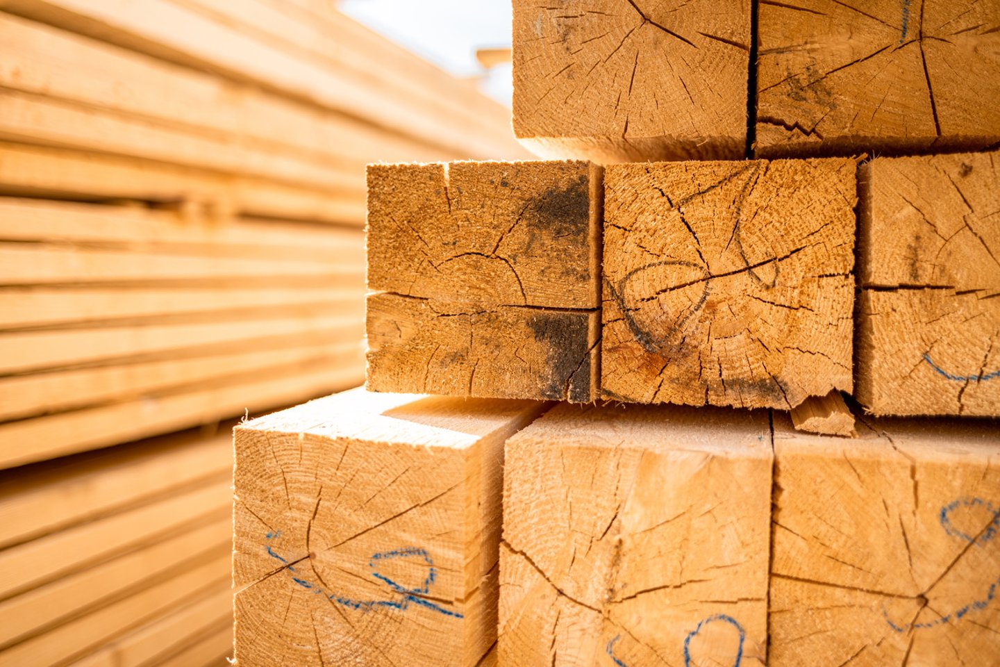 Stack of lumber wooden beams prepared to build a house; Shutterstock ID 1724945815