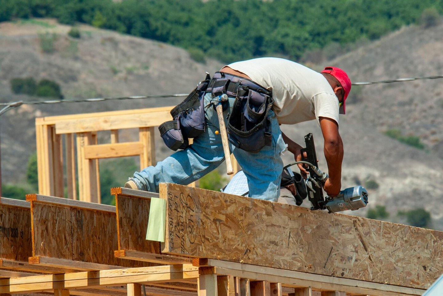 2024 April 12: Filmore, CA: Hispanic construction workers building residential homes outdoors, hand labor at construction site. ; Shutterstock ID 2448788451