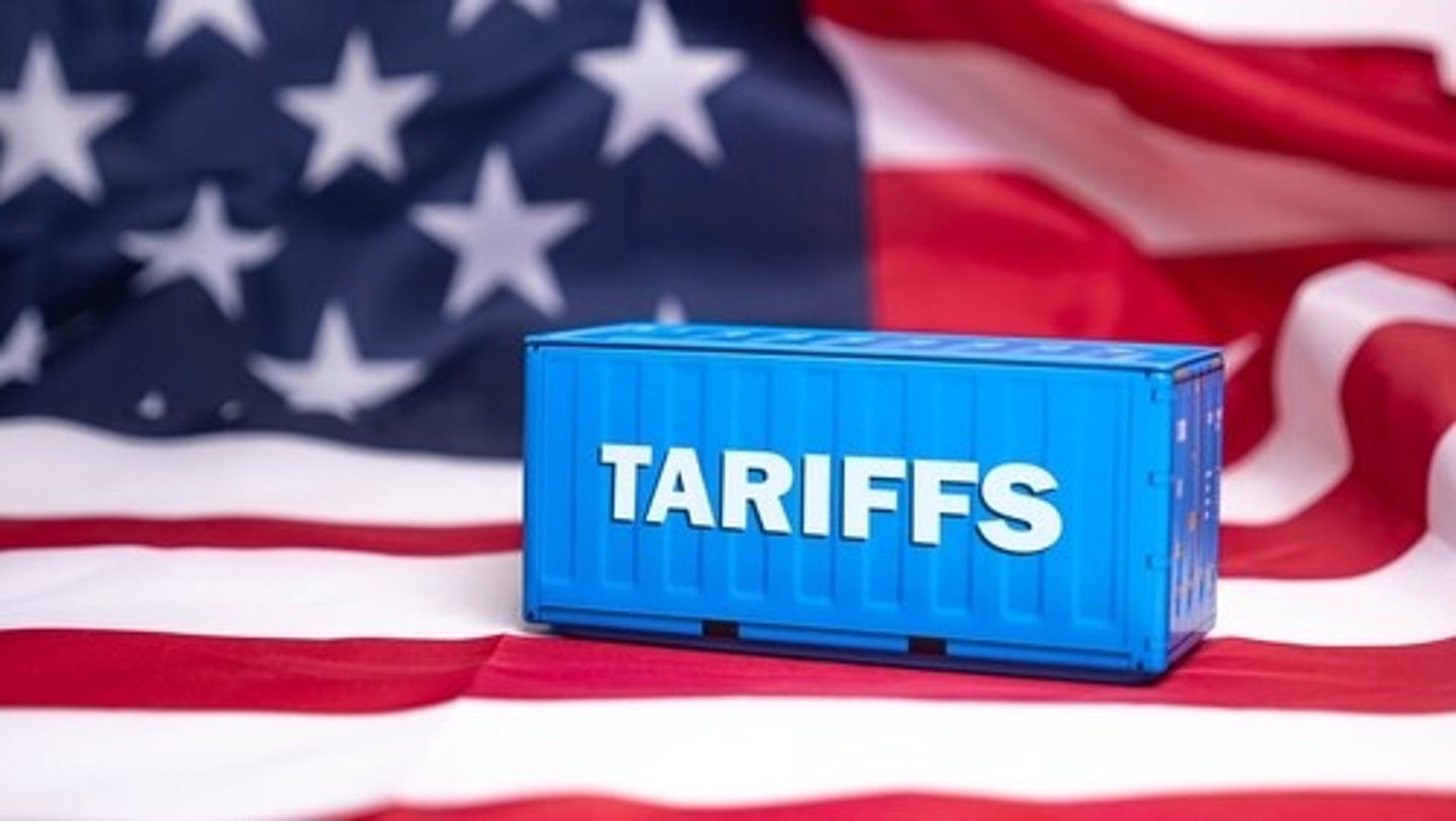 Container tariffs word on Flag of the United States of America background.