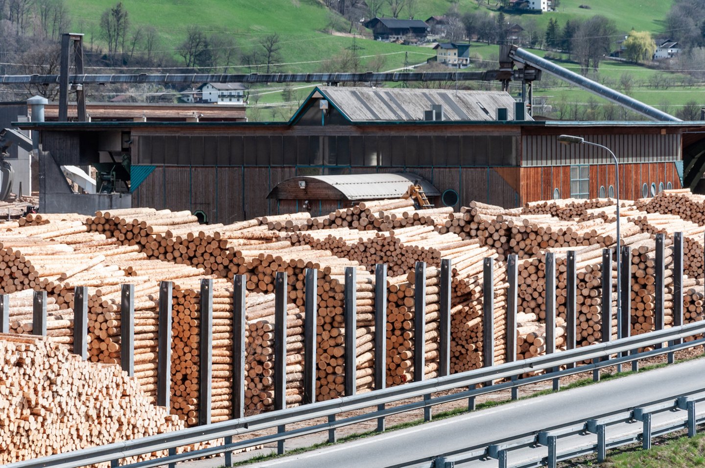 Stock timber in saw mill. Loader working in saw mill. A lot of trunks, stack of wood lumber.; Shutterstock ID 1389136391