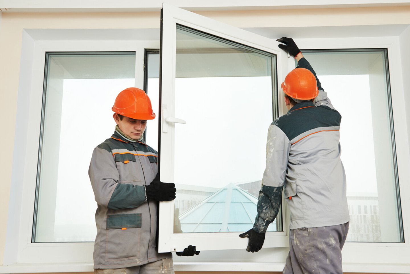 Two male industrial builders workers at window installation; Shutterstock ID 254497834